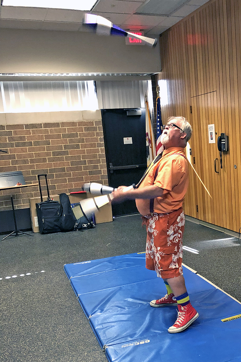 Juggling was part of the act for Dr. Gesundheit when he put on a show at the Homewood Public Library.