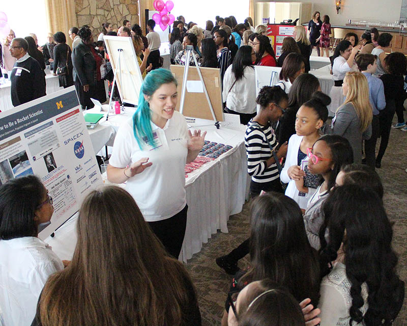 Meghan Ostermann, who works for SpaceX, talks to a group of girls about her work during the 2018 Girls STEAM Ahead event sponsored by the Homewood Science Center. (Chronicle file photo)