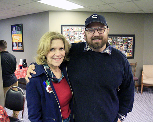Geni Cutler, left, and Nick Koster, officials with Suburban Access and Open Access respectively, pause during the busy Turkey Day Giveaway on Tuesday. (Eric Crump/H-F Chronicle)