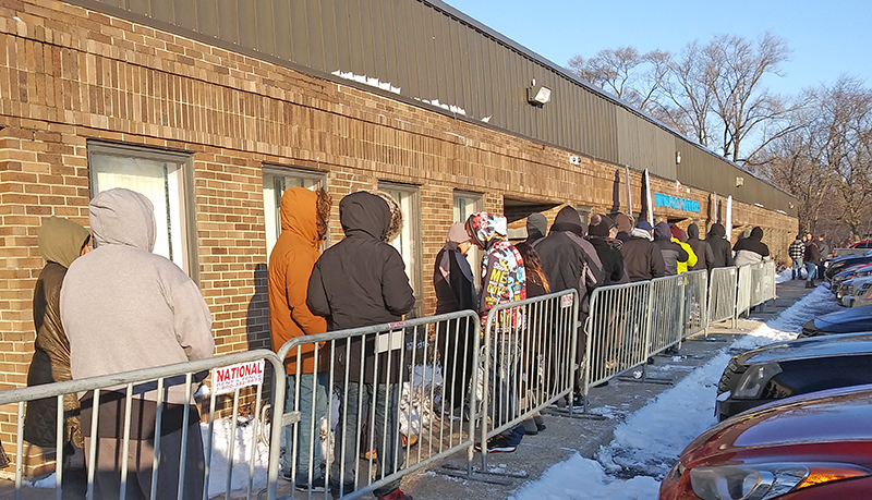 A crowd of at least 50 people waits in line about 2 1/2 hours before Windy City Cannabis in Homewood was scheduled to open to begin recreational cannabis sales on New Year's Day. (Chronicle file photo) 