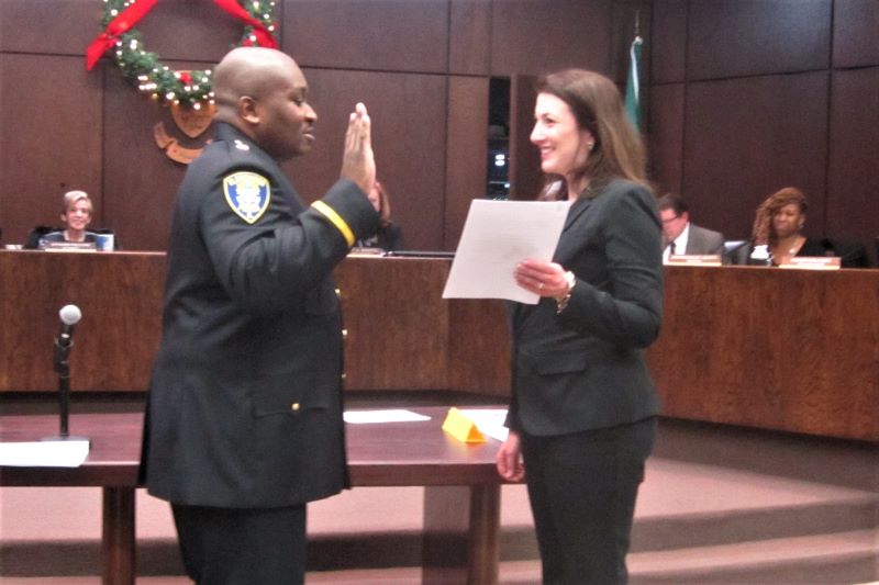 Police Commander Keith Taylor is sworn in by Village Clerk Ananda Billings on Monday, Jan. 6. Police Chief Tod Kamleiter promoted Taylor from sergeant last month.
