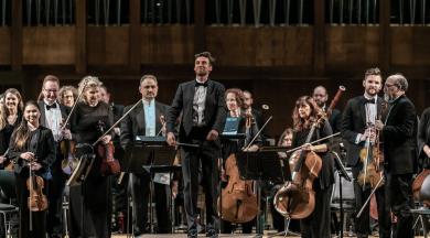 Illinois Philharmonic Orchestra music director and conductor Stilian Kirov and IPO musicians accept a round of applause from the audience at a recent concert. (Provided)