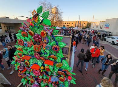 A large tree of life towers over Martin Square during the Dia de los Muertos festival. (EC)