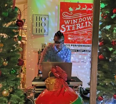 DJ Phil Lee prepares to spin tunes during the first Windows on Sterling performance. (EC)