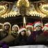 The Grand Prairie Children's Choir sings in front of the carousel at Holiday Lights in Homewood.