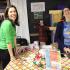 Science center staffers Kate Purvis, left, and Amy Eagle on duty in Santa's Workshop, where kids could make ornaments or candy trains.